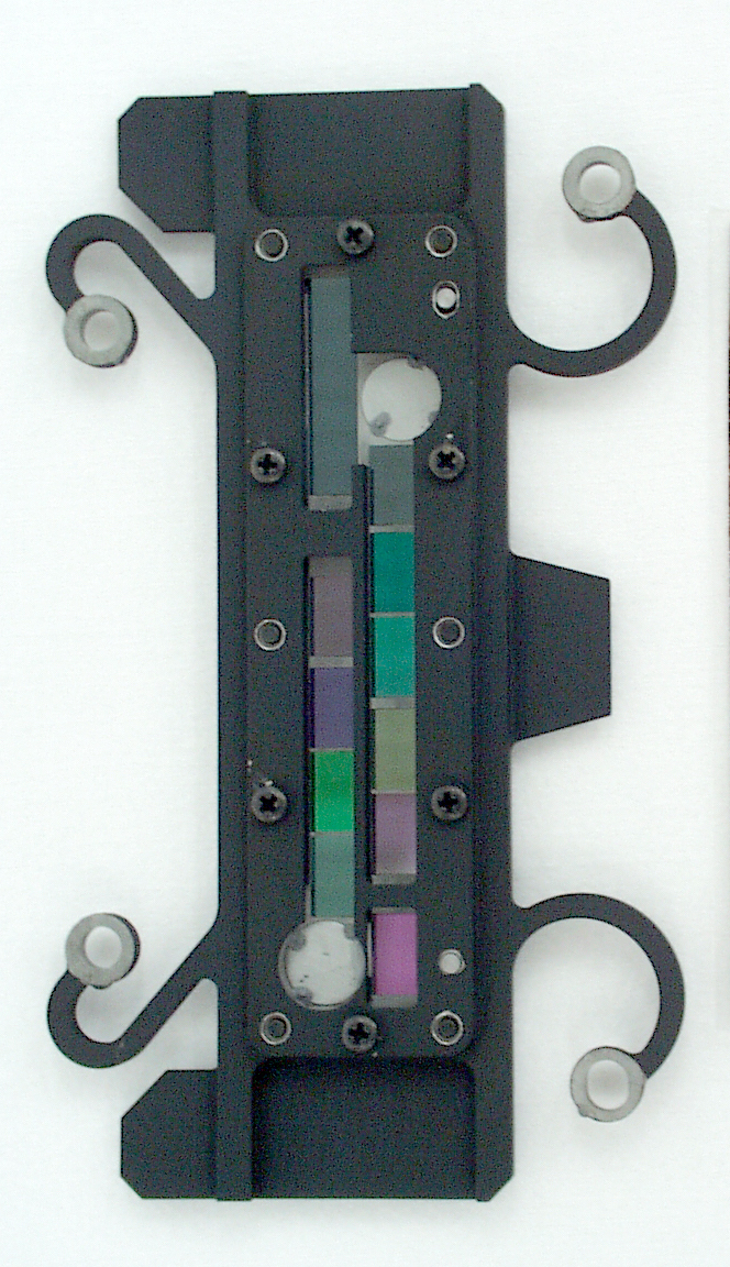 Photo of AIRS aperture filter assembly, backside. The white disks are covered alignment holes.